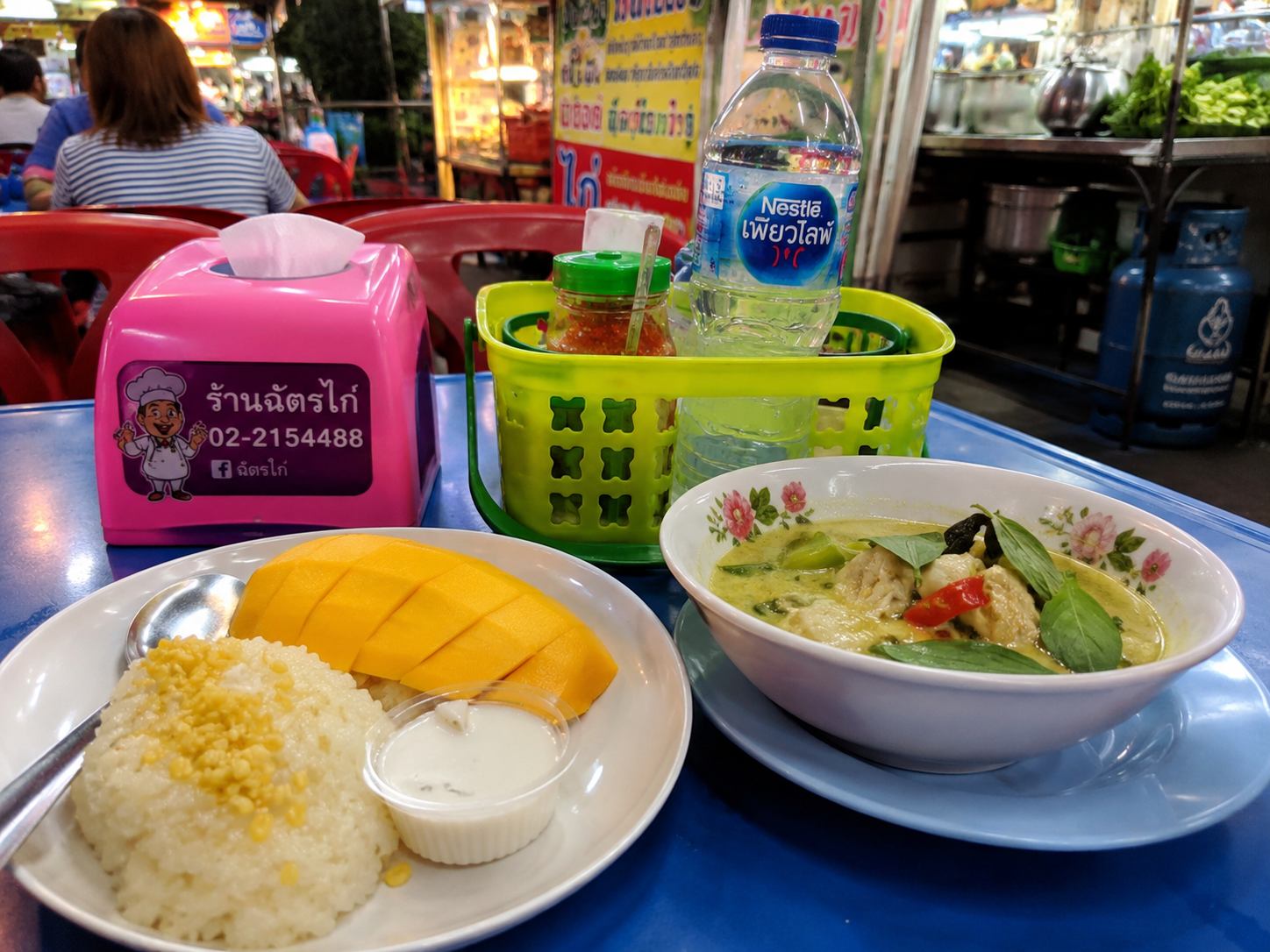 Bangkok street food stalls and golden temple spires at sunset, budget travel guide 2026