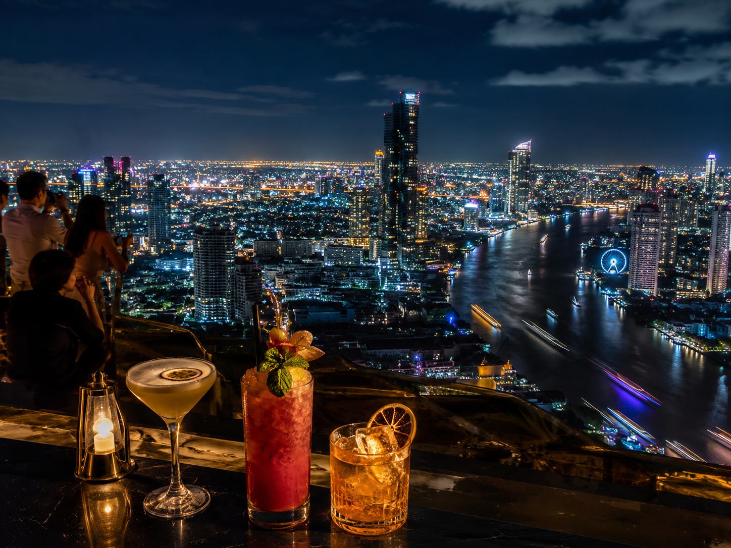 Bangkok city skyline glowing at dusk viewed from a rooftop bar, with golden light over skyscrapers and the Chao Phraya River visible in the distance