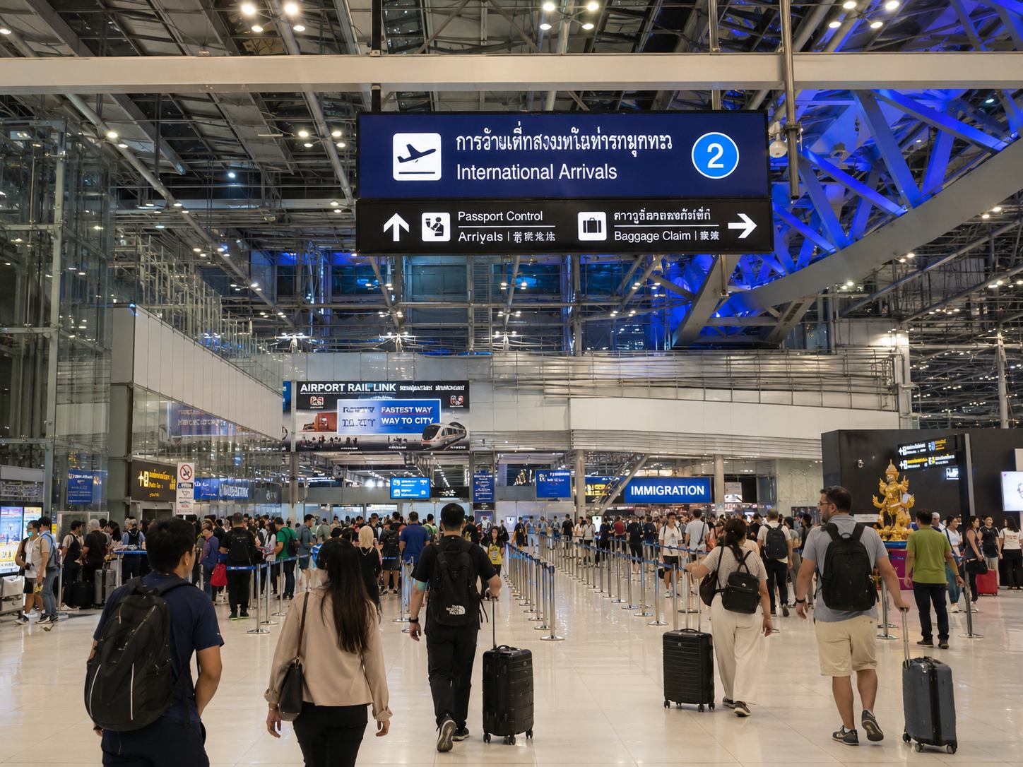 Suvarnabhumi Airport immigration arrivals hall Bangkok with Visa on Arrival counter signage and passengers queuing