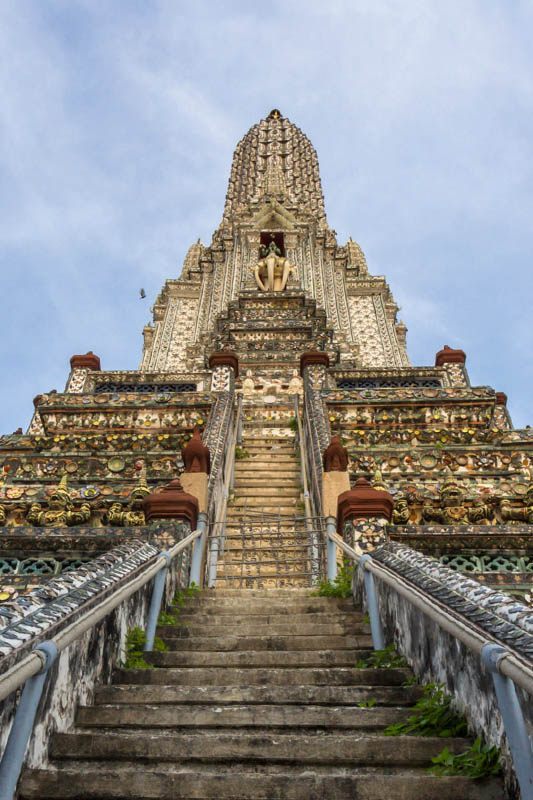 Wat Arun Temple climbing experience with tourists on steep stairs